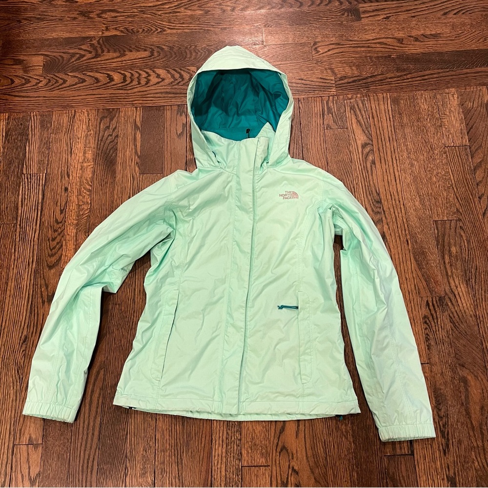 The North Face women’s raincoat in seaglass green
